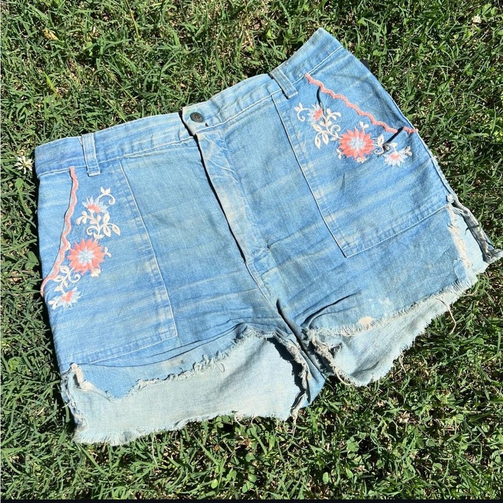 Vintage denim cutoffs with floral embellishment